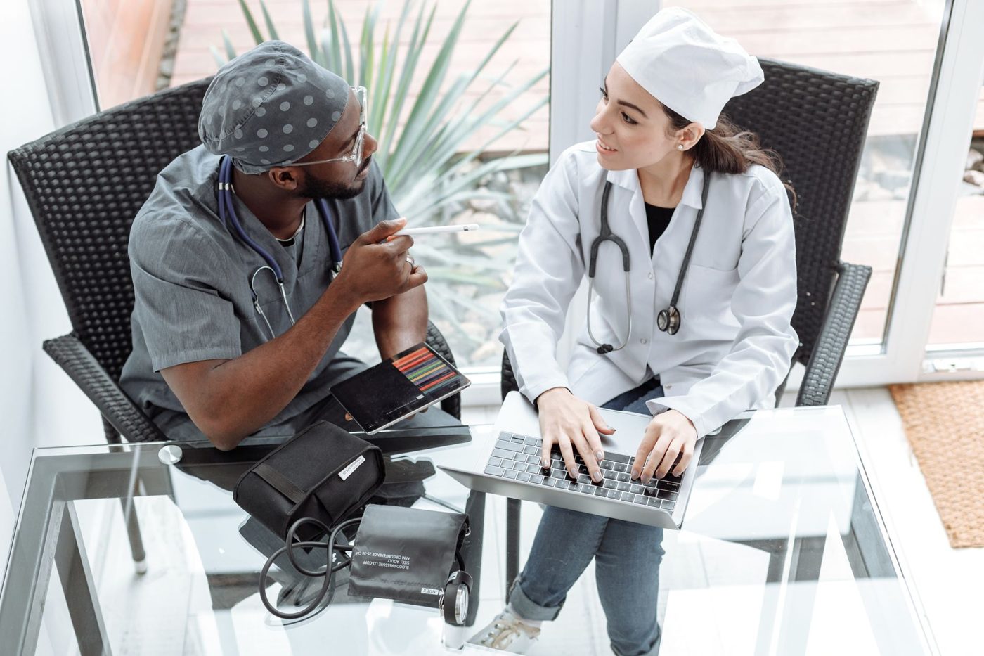 Two clinicians reviewing a client's care together at a laptop
